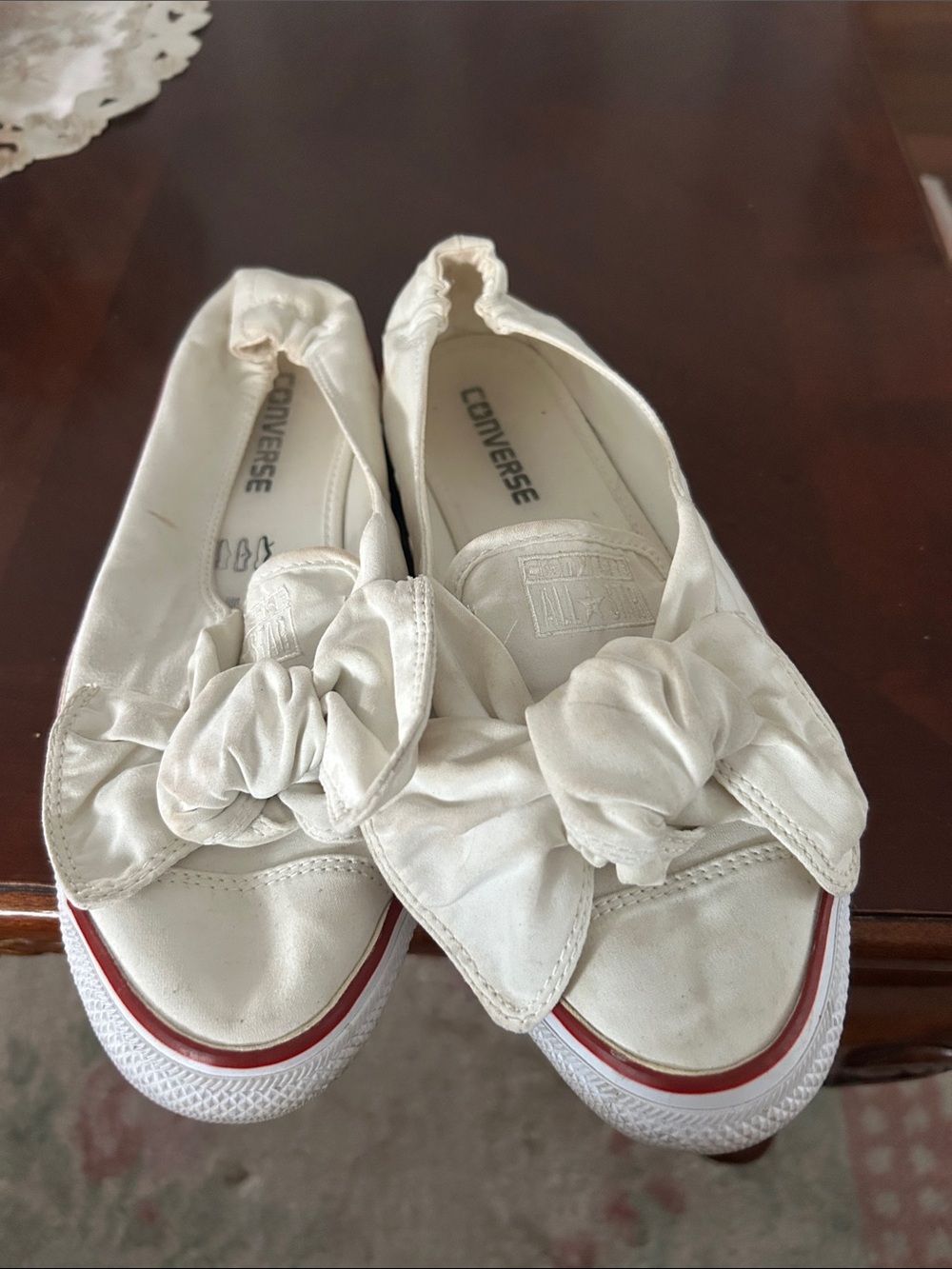 Converse Women's White Slip-On Bow Sneakers with Red Accent